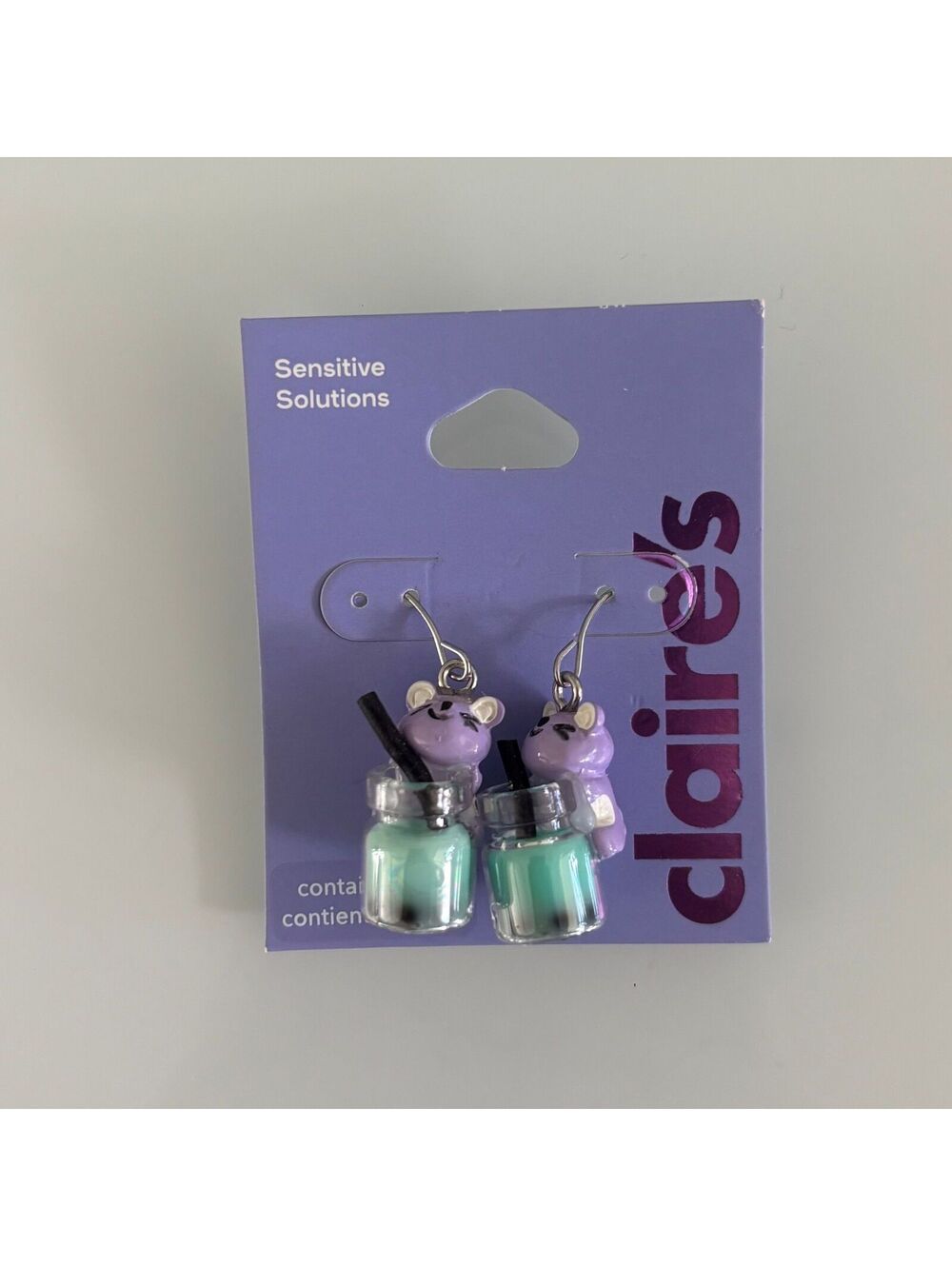Claire’s Purple Hamster Drinking Boba Earrings